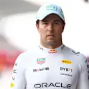 MEXICO CITY, MEXICO - OCTOBER 26: 18th placed qualifier Sergio Perez of Mexico and Oracle Red Bull Racing walks in the Pitlane during qualifying ahead of the F1 Grand Prix of Mexico at Autodromo Hermanos Rodriguez on October 26, 2024 in Mexico City, Mexico. (Photo by Bryn Lennon - Formula 1/Formula 1 via Getty Images)