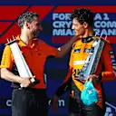 MIAMI, FLORIDA - MAY 05: Race winner Lando Norris of Great Britain and McLaren celebrates with McLaren Team Principal Andrea Stella on the podium after the F1 Grand Prix of Miami at Miami International Autodrome on May 05, 2024 in Miami, Florida. (Photo by Mark Thompson/Getty Images)