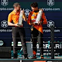 MIAMI, FLORIDA - MAY 05: Race winner Lando Norris of Great Britain and McLaren and McLaren Team Principal Andrea Stella celebrate on the podium after the F1 Grand Prix of Miami at Miami International Autodrome on May 05, 2024 in Miami, Florida. (Photo by Chris Graythen/Getty Images)