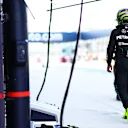 MIAMI, FLORIDA - MAY 03: 12th placed qualifier Lewis Hamilton of Great Britain and Mercedes walks in the Pitlane during Sprint Qualifying ahead of the F1 Grand Prix of Miami at Miami International Autodrome on May 03, 2024 in Miami, Florida. (Photo by Mark Thompson/Getty Images)