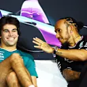 MIAMI, FLORIDA - MAY 02: Lance Stroll of Canada and Aston Martin F1 Team and Lewis Hamilton of Great Britain and Mercedes talk in the Drivers Press Conference during previews ahead of the F1 Grand Prix of Miami at Miami International Autodrome on May 02, 2024 in Miami, Florida. (Photo by Clive Rose/Getty Images)