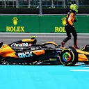 MIAMI, FLORIDA - MAY 04: Lando Norris of Great Britain and McLaren walks away from his car after stopping on track during the Sprint ahead of the F1 Grand Prix of Miami at Miami International Autodrome on May 04, 2024 in Miami, Florida. (Photo by Mark Thompson/Getty Images)