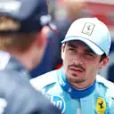 MIAMI, FLORIDA - MAY 04: Second placed Charles Leclerc of Monaco and Ferrari talks with sprint winner Max Verstappen of the Netherlands and Oracle Red Bull Racing in parc ferme during the Sprint ahead of the F1 Grand Prix of Miami at Miami International Autodrome on May 04, 2024 in Miami, Florida. (Photo by Clive Rose - Formula 1/Formula 1 via Getty Images)