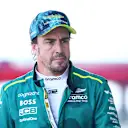 MIAMI, FLORIDA - MAY 04: 15th placed qualifier Fernando Alonso of Spain and Aston Martin F1 Team walks in the Pitlane during qualifying ahead of the F1 Grand Prix of Miami at Miami International Autodrome on May 04, 2024 in Miami, Florida. (Photo by Clive Rose - Formula 1/Formula 1 via Getty Images)