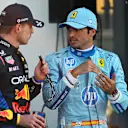 MIAMI, FLORIDA - MAY 04: Pole position qualifier Max Verstappen of the Netherlands and Oracle Red Bull Racing and Third placed qualifier Carlos Sainz of Spain and Ferrari talk in parc ferme during qualifying ahead of the F1 Grand Prix of Miami at Miami International Autodrome on May 04, 2024 in Miami, Florida. (Photo by Rudy Carezzevoli/Getty Images)