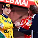 MONTE-CARLO, MONACO - MAY 26: Second placed Oscar Piastri of Australia and McLaren celebrates with Andrea Casiraghi on the podium during the F1 Grand Prix of Monaco at Circuit de Monaco on May 26, 2024 in Monte-Carlo, Monaco. (Photo by Bryn Lennon - Formula 1/Formula 1 via Getty Images)