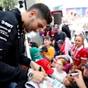 MONTE-CARLO, MONACO - MAY 24: Esteban Ocon of France and Alpine F1 signs autographs for fans in the fan stage prior to practice ahead of the F1 Grand Prix of Monaco at Circuit de Monaco on May 24, 2024 in Monte-Carlo, Monaco. (Photo by Peter Fox - Formula 1/Formula 1 via Getty Images)