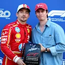 MONTE-CARLO, MONACO - MAY 25: Pole position qualifier Charles Leclerc of Monaco and Ferrari is presented with the Pirelli Pole Position Award by Nicholas Galitzine in parc ferme during qualifying ahead of the F1 Grand Prix of Monaco at Circuit de Monaco on May 25, 2024 in Monte-Carlo, Monaco. (Photo by Bryn Lennon - Formula 1/Formula 1 via Getty Images)