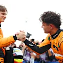 ZANDVOORT, NETHERLANDS - AUGUST 24: Pole position qualifier Lando Norris of Great Britain and McLaren interacts with third placed qualifier Oscar Piastri of Australia and McLaren in parc ferme after qualifying ahead of the F1 Grand Prix of Netherlands at Circuit Zandvoort on August 24, 2024 in Zandvoort, Netherlands. (Photo by Bryn Lennon - Formula 1/Formula 1 via Getty Images)