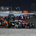 LUSAIL CITY, QATAR - DECEMBER 01: George Russell of Great Britain driving the (63) Mercedes AMG Petronas F1 Team W15 leads Charles Leclerc of Monaco driving the (16) Ferrari SF-24 on track during the F1 Grand Prix of Qatar at Lusail International Circuit on December 01, 2024 in Lusail City, Qatar. (Photo by James Sutton - Formula 1/Formula 1 via Getty Images)
