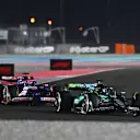 LUSAIL CITY, QATAR - DECEMBER 01: Lance Stroll of Canada driving the (18) Aston Martin AMR24 Mercedes leads Liam Lawson of New Zealand driving the (30) Visa Cash App RB VCARB 01 on track during the F1 Grand Prix of Qatar at Lusail International Circuit on December 01, 2024 in Lusail City, Qatar. (Photo by James Sutton - Formula 1/Formula 1 via Getty Images)