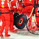 LUSAIL CITY, QATAR - DECEMBER 01: Ferrari team members hold the punctured tire of Carlos Sainz of Spain and Ferrari in the Pitlane during the F1 Grand Prix of Qatar at Lusail International Circuit on December 01, 2024 in Lusail City, Qatar. (Photo by Peter Fox/Getty Images)