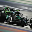 LUSAIL CITY, QATAR - DECEMBER 01: Fernando Alonso of Spain driving the (14) Aston Martin AMR24 Mercedes leads Zhou Guanyu of China driving the (24) Kick Sauber C44 Ferrari on track during the F1 Grand Prix of Qatar at Lusail International Circuit on December 01, 2024 in Lusail City, Qatar. (Photo by Clive Mason/Getty Images)