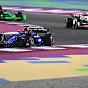 LUSAIL CITY, QATAR - DECEMBER 01: Alexander Albon of Thailand driving the (23) Williams FW46 Mercedes leads Kevin Magnussen of Denmark driving the (20) Haas F1 VF-24 Ferrari and Valtteri Bottas of Finland driving the (77) Kick Sauber C44 Ferrari on track during the F1 Grand Prix of Qatar at Lusail International Circuit on December 01, 2024 in Lusail City, Qatar. (Photo by Pauline Ballet - Formula 1/Formula 1 via Getty Images)