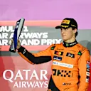 LUSAIL CITY, QATAR - DECEMBER 01: Third placed Oscar Piastri of Australia and McLaren celebrates on the podium during the F1 Grand Prix of Qatar at Lusail International Circuit on December 01, 2024 in Lusail City, Qatar. (Photo by Mark Sutton - Formula 1/Formula 1 via Getty Images)