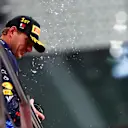 LUSAIL CITY, QATAR - DECEMBER 01: Race winner Max Verstappen of the Netherlands and Oracle Red Bull Racing celebrates on the podium during the F1 Grand Prix of Qatar at Lusail International Circuit on December 01, 2024 in Lusail City, Qatar. (Photo by Joe Portlock/Getty Images)