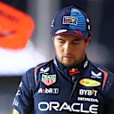 LUSAIL CITY, QATAR - NOVEMBER 29: 16th placed qualifier Sergio Perez of Mexico and Oracle Red Bull Racing walks in the Pitlane during Sprint Qualifying ahead of the F1 Grand Prix of Qatar at Lusail International Circuit on November 29, 2024 in Lusail City, Qatar. (Photo by Bryn Lennon - Formula 1/Formula 1 via Getty Images)