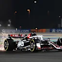 LUSAIL CITY, QATAR - NOVEMBER 29: Sparks fly behind Kevin Magnussen of Denmark driving the (20) Haas F1 VF-24 Ferrari on track during Sprint Qualifying ahead of the F1 Grand Prix of Qatar at Lusail International Circuit on November 29, 2024 in Lusail City, Qatar. (Photo by Mark Sutton - Formula 1/Formula 1 via Getty Images)