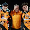 LUSAIL CITY, QATAR - NOVEMBER 30: Race winner Oscar Piastri of Australia and McLaren, McLaren Chief Executive Officer Zak Brown and second placed Lando Norris of Great Britain and McLaren pose for a photo in parc ferme during the Sprint ahead of the F1 Grand Prix of Qatar at Lusail International Circuit on November 30, 2024 in Lusail City, Qatar. (Photo by Bryn Lennon - Formula 1/Formula 1 via Getty Images)