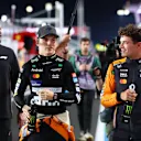 LUSAIL CITY, QATAR - NOVEMBER 30: Sprint winner Oscar Piastri of Australia and McLaren and Second placed Lando Norris of Great Britain and McLaren walks in the Pitlane after the Sprint ahead of the F1 Grand Prix of Qatar at Lusail International Circuit on November 30, 2024 in Lusail City, Qatar. (Photo by Bryn Lennon - Formula 1/Formula 1 via Getty Images)