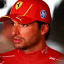 LUSAIL CITY, QATAR - NOVEMBER 30: 4th placed Carlos Sainz of Spain and Ferrari talks to the media in the Paddock after the Sprint ahead of the F1 Grand Prix of Qatar at Lusail International Circuit on November 30, 2024 in Lusail City, Qatar. (Photo by Peter Fox/Getty Images)