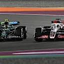 LUSAIL CITY, QATAR - NOVEMBER 30: Fernando Alonso of Spain driving the (14) Aston Martin AMR24 Mercedes and Kevin Magnussen of Denmark driving the (20) Haas F1 VF-24 Ferrari battle for track position during the Sprint ahead of the F1 Grand Prix of Qatar at Lusail International Circuit on November 30, 2024 in Lusail City, Qatar. (Photo by Mark Sutton - Formula 1/Formula 1 via Getty Images)