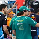 JEDDAH, SAUDI ARABIA - MARCH 09: Lance Stroll of Canada and Aston Martin F1 Team and Esteban Ocon of France and Alpine F1 wave to the crowd on the drivers parade prior to the F1 Grand Prix of Saudi Arabia at Jeddah Corniche Circuit on March 09, 2024 in Jeddah, Saudi Arabia. (Photo by Peter Fox - Formula 1/Formula 1 via Getty Images)