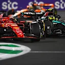 JEDDAH, SAUDI ARABIA - MARCH 09: Lewis Hamilton of Great Britain driving the (44) Mercedes AMG Petronas F1 Team W15 and Charles Leclerc of Monaco driving the (16) Ferrari SF-24 battle for track position during the F1 Grand Prix of Saudi Arabia at Jeddah Corniche Circuit on March 09, 2024 in Jeddah, Saudi Arabia. (Photo by Rudy Carezzevoli/Getty Images)