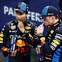 JEDDAH, SAUDI ARABIA - MARCH 09: Second placed Sergio Perez of Mexico and Oracle Red Bull Racing and Race winner Max Verstappen of the Netherlands and Oracle Red Bull Racing react in parc ferme during the F1 Grand Prix of Saudi Arabia at Jeddah Corniche Circuit on March 09, 2024 in Jeddah, Saudi Arabia. (Photo by Clive Rose/Getty Images)