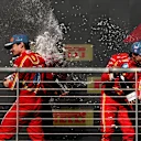 AUSTIN, TEXAS - OCTOBER 20: Race winner Charles Leclerc of Monaco and Ferrari and Second placed Carlos Sainz of Spain and Ferrari celebrate on the podium after the F1 Grand Prix of United States at Circuit of The Americas on October 20, 2024 in Austin, Texas. (Photo by Jared C. Tilton/Getty Images)