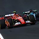 AUSTIN, TEXAS - OCTOBER 19: Carlos Sainz of Spain driving (55) the Ferrari SF-24 leads George Russell of Great Britain driving the (63) Mercedes AMG Petronas F1 Team W15 and Charles Leclerc of Monaco driving the (16) Ferrari SF-24 during the Sprint ahead of the F1 Grand Prix of United States at Circuit of The Americas on October 19, 2024 in Austin, Texas. (Photo by Mark Thompson/Getty Images)
