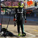 AUSTIN, TEXAS - OCTOBER 19: 19th placed qualifier Lewis Hamilton of Great Britain and Mercedes walks in the Pitlane during qualifying ahead of the F1 Grand Prix of United States at Circuit of The Americas on October 19, 2024 in Austin, Texas. (Photo by Mark Thompson/Getty Images)