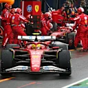 MELBOURNE, AUSTRALIA - MARCH 16: Lewis Hamilton of Great Britain driving the (44) Scuderia Ferrari SF-25 in the Pitlane as Charles Leclerc of Monaco driving the (16) Scuderia Ferrari SF-25 makes a pitstop during the F1 Grand Prix of Australia at Albert Park Grand Prix Circuit on March 16, 2025 in Melbourne, Australia. (Photo by Clive Rose/Getty Images)