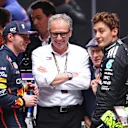 MELBOURNE, AUSTRALIA - MARCH 16: Second placed Max Verstappen of the Netherlands and Oracle Red Bull Racing and Third placed George Russell of Great Britain and Mercedes AMG Petronas F1 Team with Stefano Domenicali, CEO of the Formula One Group in parc ferme during the F1 Grand Prix of Australia at Albert Park Grand Prix Circuit on March 16, 2025 in Melbourne, Australia. (Photo by Clive Rose/Getty Images)