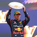 MELBOURNE, AUSTRALIA - MARCH 16: Second placed Max Verstappen of the Netherlands and Oracle Red Bull Racing on the podium with his trophy during the F1 Grand Prix of Australia at Albert Park Grand Prix Circuit on March 16, 2025 in Melbourne, Australia. (Photo by Clive Rose/Getty Images)