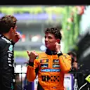 MELBOURNE, AUSTRALIA - MARCH 16: Third placed George Russell of Great Britain and Mercedes AMG Petronas F1 Team and Race winner Lando Norris of Great Britain and McLaren talk in parc ferme during the F1 Grand Prix of Australia at Albert Park Grand Prix Circuit on March 16, 2025 in Melbourne, Australia. (Photo by Bryn Lennon - Formula 1/Formula 1 via Getty Images)