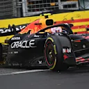 MELBOURNE, AUSTRALIA - MARCH 16: Liam Lawson of New Zealand driving the (30) Oracle Red Bull Racing RB21 crashes during the F1 Grand Prix of Australia at Albert Park Grand Prix Circuit on March 16, 2025 in Melbourne, Australia. (Photo by James Sutton - Formula 1/Formula 1 via Getty Images)