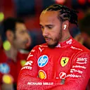 MELBOURNE, AUSTRALIA - MARCH 14: Lewis Hamilton of Great Britain and Scuderia Ferrari prepares to drive in the garage prior to practice ahead of the F1 Grand Prix of Australia at Albert Park Grand Prix Circuit on March 14, 2025 in Melbourne, Australia. (Photo by Bryn Lennon - Formula 1/Formula 1 via Getty Images)