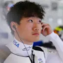 MELBOURNE, AUSTRALIA - MARCH 14: Yuki Tsunoda of Japan and Visa Cash App Racing Bulls looks on in the garage during practice ahead of the F1 Grand Prix of Australia at Albert Park Grand Prix Circuit on March 14, 2025 in Melbourne, Australia. (Photo by Rudy Carezzevoli/Getty Images)