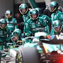 SHANGHAI, CHINA - MARCH 23: Lance Stroll of Canada driving the (18) Aston Martin F1 Team AMR25 Mercedes makes a pitstop during the F1 Grand Prix of China at Shanghai International Circuit on March 23, 2025 in Shanghai, China. (Photo by Clive Rose/Getty Images)