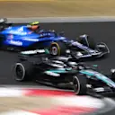 SHANGHAI, CHINA - MARCH 23: George Russell of Great Britain driving the (63) Mercedes AMG Petronas F1 Team W16 leads Carlos Sainz of Spain driving the (55) Williams FW47 Mercedes on track during the F1 Grand Prix of China at Shanghai International Circuit on March 23, 2025 in Shanghai, China. (Photo by Clive Mason/Getty Images)