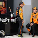 SHANGHAI, CHINA - MARCH 23: Second placed Lando Norris of Great Britain and McLaren and Race winner Oscar Piastri of Australia and McLaren talk in parc ferme during the F1 Grand Prix of China at Shanghai International Circuit on March 23, 2025 in Shanghai, China. (Photo by Clive Rose/Getty Images)