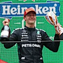 SHANGHAI, CHINA - MARCH 23: Third placed George Russell of Great Britain and Mercedes AMG Petronas F1 Team on the podium with his trophy during the F1 Grand Prix of China at Shanghai International Circuit on March 23, 2025 in Shanghai, China. (Photo by Clive Rose/Getty Images)