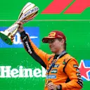 SHANGHAI, CHINA - MARCH 23: Race winner Oscar Piastri of Australia and McLaren lifts his trophy on the podium during the F1 Grand Prix of China at Shanghai International Circuit on March 23, 2025 in Shanghai, China. (Photo by Clive Rose/Getty Images)