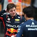 SHANGHAI, CHINA - MARCH 23: Fourth placed Max Verstappen of the Netherlands and Oracle Red Bull Racing and Ninth placed Alexander Albon of Thailand and Williams talk in parc ferme during the F1 Grand Prix of China at Shanghai International Circuit on March 23, 2025 in Shanghai, China. (Photo by Rudy Carezzevoli/Getty Images)