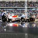 SHANGHAI, CHINA - MARCH 21: Mechanics in the Pitlane with Yuki Tsunoda of Japan driving the (22) Visa Cash App Racing Bulls VCARB 02 during Sprint Qualifying ahead of the F1 Grand Prix of China at Shanghai International Circuit on March 21, 2025 in Shanghai, China. (Photo by Rudy Carezzevoli/Getty Images)