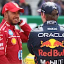 SHANGHAI, CHINA - MARCH 22: Sprint winner Lewis Hamilton of Great Britain and Scuderia Ferrari and Third placed Max Verstappen of the Netherlands and Oracle Red Bull Racing talk in parc ferme during the Sprint ahead of the F1 Grand Prix of China at Shanghai International Circuit on March 22, 2025 in Shanghai, China. (Photo by Mark Thompson/Getty Images)