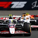 SHANGHAI, CHINA - MARCH 22: Oliver Bearman of Great Britain driving the (87) Haas F1 VF-25 Ferrari leads Isack Hadjar of France driving the (6) Visa Cash App Racing Bulls VCARB 02 on track  during the Sprint ahead of the F1 Grand Prix of China at Shanghai International Circuit on March 22, 2025 in Shanghai, China. (Photo by Clive Mason/Getty Images)