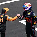 SHANGHAI, CHINA - MARCH 22: Second placed Oscar Piastri of Australia and McLaren and Third placed Max Verstappen of the Netherlands and Oracle Red Bull Racing congratulate each other in parc ferme during the Sprint ahead of the F1 Grand Prix of China at Shanghai International Circuit on March 22, 2025 in Shanghai, China. (Photo by Mark Sutton - Formula 1/Formula 1 via Getty Images)