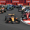 SHANGHAI, CHINA - MARCH 22: Oscar Piastri of Australia driving the (81) McLaren MCL39 Mercedes leads Charles Leclerc of Monaco driving the (16) Scuderia Ferrari SF-25 at the start during the Sprint ahead of the F1 Grand Prix of China at Shanghai International Circuit on March 22, 2025 in Shanghai, China. (Photo by Mark Thompson/Getty Images)